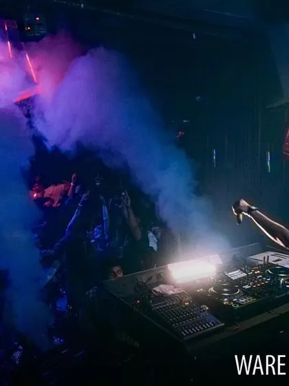 A dramatic shot with CO2 cannons firing at Warehouse Cafe, creating a smoky, atmospheric effect on stage.