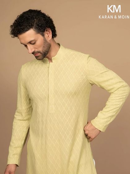 This angle highlights the texture and fit of the pastel woven kurta. It’s a garment designed for the man who believes elegance isn’t loud, it’s lived.