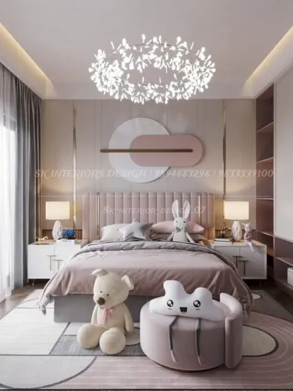 A charming kids' bedroom with a soft pink color palette and playful decor. The design includes a custom headboard, whimsical lighting, and plenty of space for play.