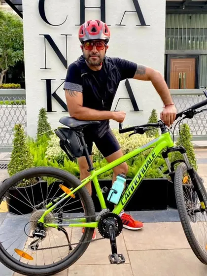 A member posing with his Cannondale bike at The Chanakya. A cool bike in a cool location.