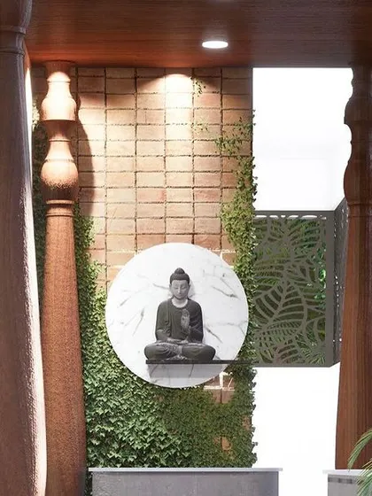 This angle shows how traditional wooden pillars frame the view of the Buddha statue, blending classic and contemporary design elements in an outdoor space.