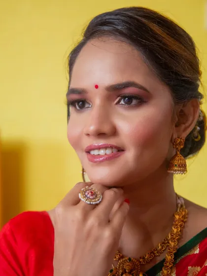 A beautiful portrait showcasing the complete look, including the traditional jewelry and bindi.