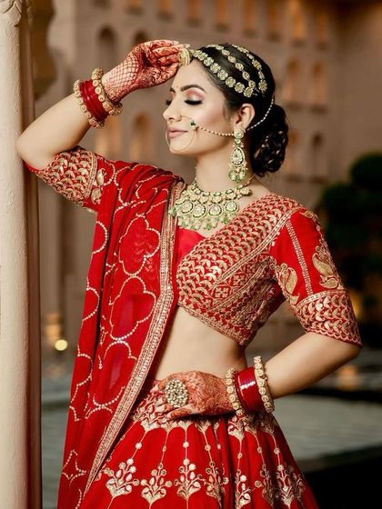 The bride's side profile shows off her elegant bun and the flawless finish of her HD makeup. This look is designed to be long-lasting and picture-perfect throughout the wedding day.