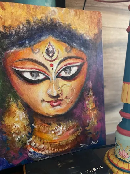 An expressive, textured acrylic painting of Ma Durga's face, completed just in time for the Shubho Shashti celebrations. The use of a palette knife adds depth and emotion to the piece.