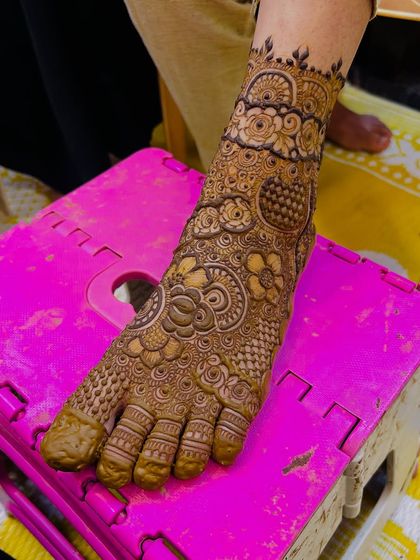 A single-leg view, showing the beautiful flow of the design from the toes to the ankle.