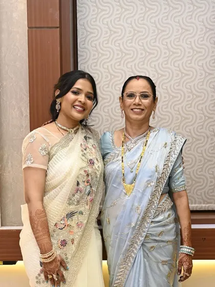 A perfect mother-in-law and daughter-in-law duo. I provided coordinated makeup for both, ensuring their looks were age-appropriate, elegant, and complemented their pastel sarees.