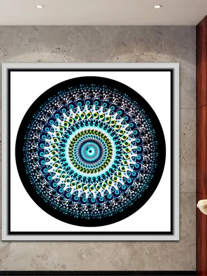 A second digital mandala, this one using cool tones of blue and green against a black background for a striking contrast.