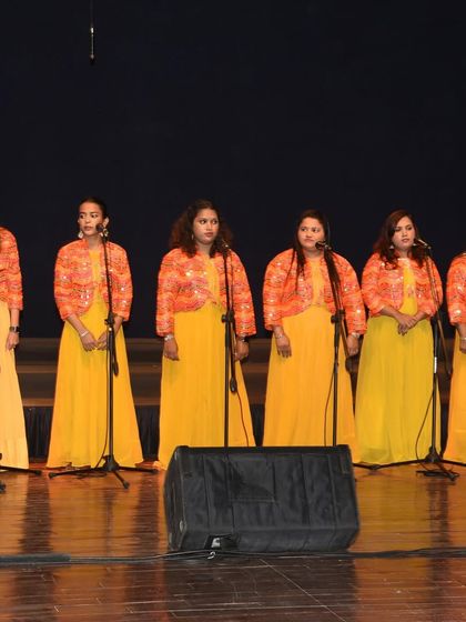 Our wonderful team of teachers performing together on stage. Their harmony and coordination reflect the spirit of our community.