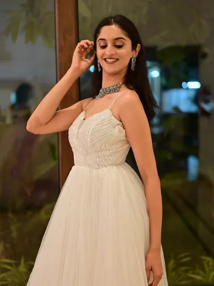 Another angle of the ethereal white gown look, showing the consistency and flawlessness of the makeup from all sides.