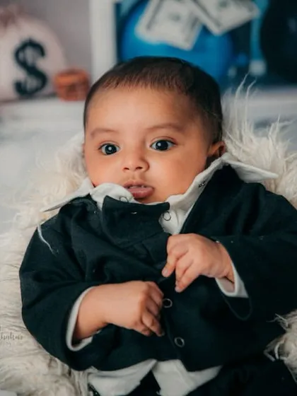 Adjusting his suit for a big meeting. This little boss has so much personality, even at just three months old.