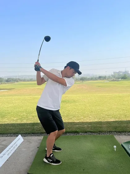 A golfer enjoying a weekend session. The spacious layout of our bays ensures you have a comfortable and focused practice environment.
