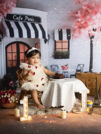 A first birthday celebration set in a charming Parisian café theme. I love bringing imaginative ideas to life for your child's milestone moments, making them truly unforgettable.