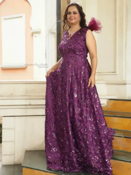 This dark purple stone outfit is another beautiful option for a party or special event. The color is rich and royal, and it's available for rent.