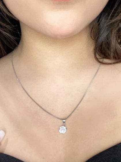 A detailed close-up of the GIVA pendant. This highlights the craftsmanship and sparkle of the jewelry, giving my audience a clear look at the product's quality.