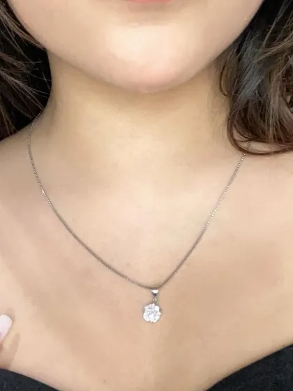 A detailed close-up of the GIVA pendant. This highlights the craftsmanship and sparkle of the jewelry, giving my audience a clear look at the product's quality.