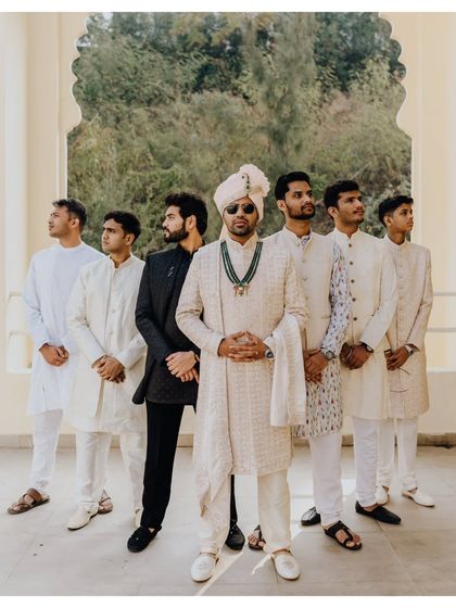 The groom and his groomsmen, looking sharp and stylish. A great shot capturing the camaraderie and support system of the groom.