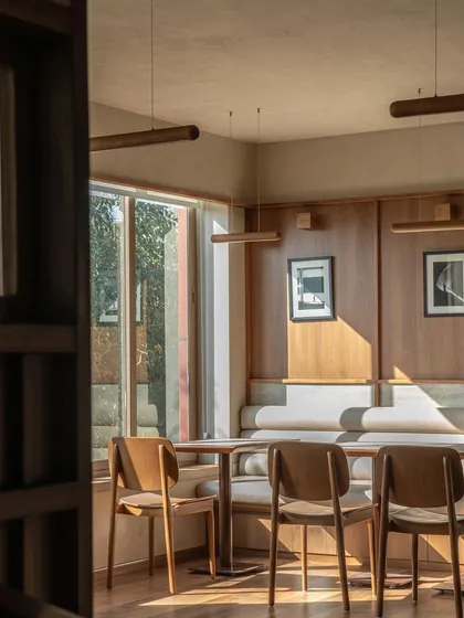 In this sunlit corner of QBF Coffee in New Delhi, I blended Japanese and Scandinavian aesthetics to create a warm, simple, and inviting atmosphere. The design uses natural wood and soft light to craft a serene haven for work, relaxation, and conversation.