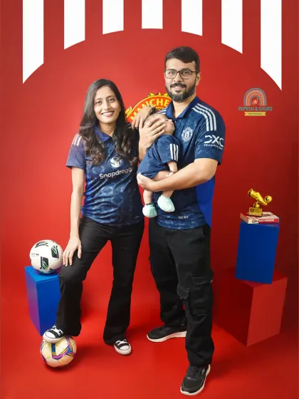 A full-length family portrait showing off their Manchester United pride. We work with you to incorporate your family's hobbies and passions into the shoot.