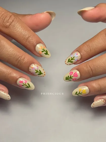 I'm obsessed with these hand-painted flowers. This design features different types of tulips and florals on a neutral beige base, done on soft gel extensions.