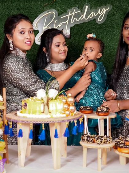 A charming 'Baby Boss' themed birthday party, with a sophisticated black and white color scheme, custom props, and a stylish backdrop, perfect for a little executive.