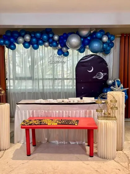 Another look at a fantastic space-themed party setup. I arrange everything from the main table and backdrop to the smaller details, ensuring a cohesive and impressive look.