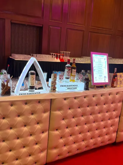 Our white tufted bar with LED displays at the Supreme Banquet for a corporate event. This setup is modern, sleek, and highly professional.