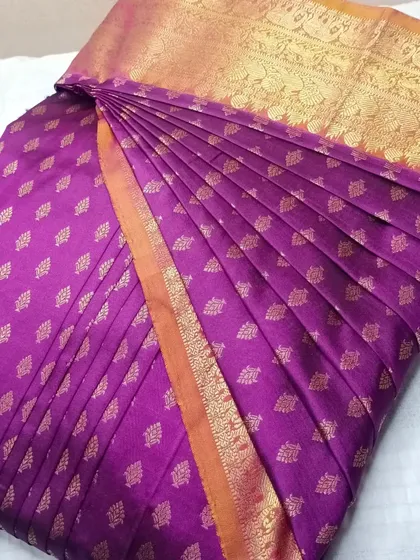 A purple Kanjeevaram saree, pleated for a perfect drape.
