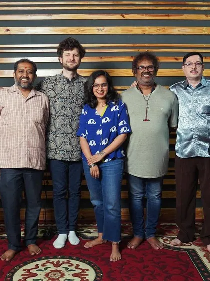 A group photo with the Bangalore folk rhythm section. It's a celebration of the artists and their invaluable contribution to the album's sound.