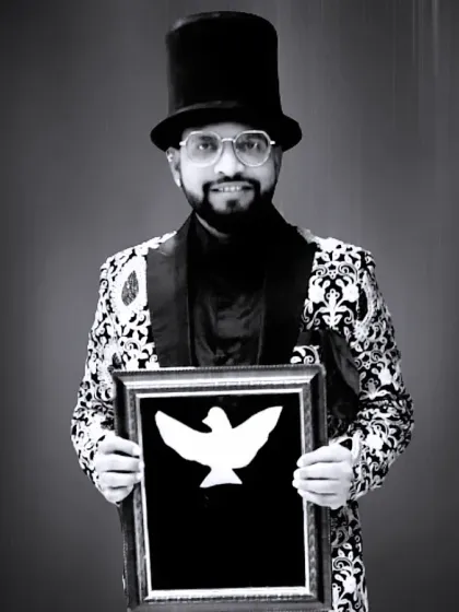 A classic magician's portrait with a dove illusion frame. This image captures the mystery and artistry of my craft.