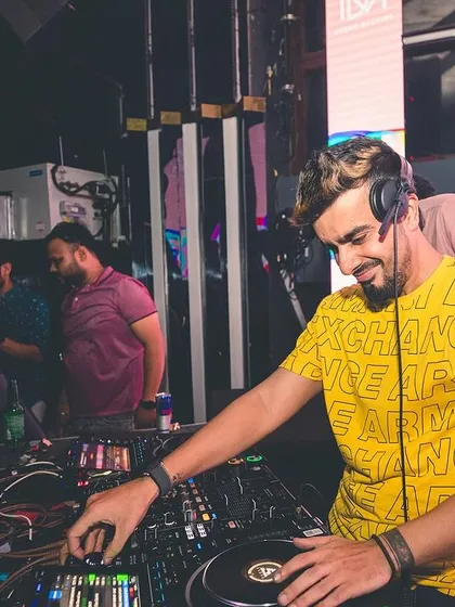 A candid moment of me smiling while mixing. When a transition comes together perfectly, you can't help but feel the joy.