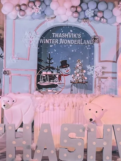 A magical "Winter Wonderland" theme for a first birthday. We used polar bear props, snowflake details, cotton snow, and a cool blue and white color palette to bring the theme to life.