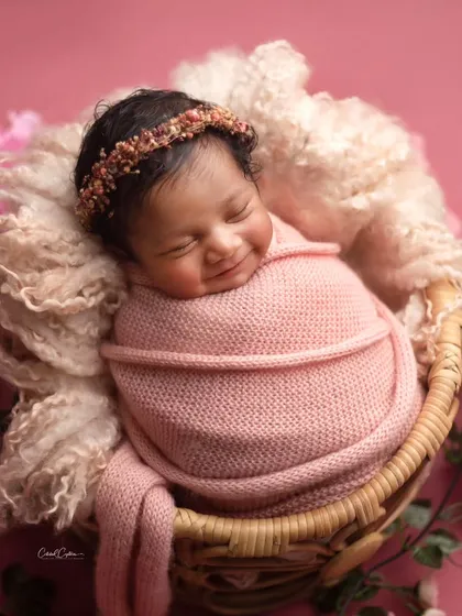 This big, joyful smile is everything. Nestled in her basket, this happy girl was full of the sweetest expressions.