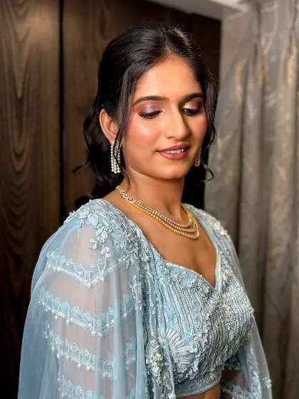 Another view of the makeup, showing the delicate shimmer on the eyes.