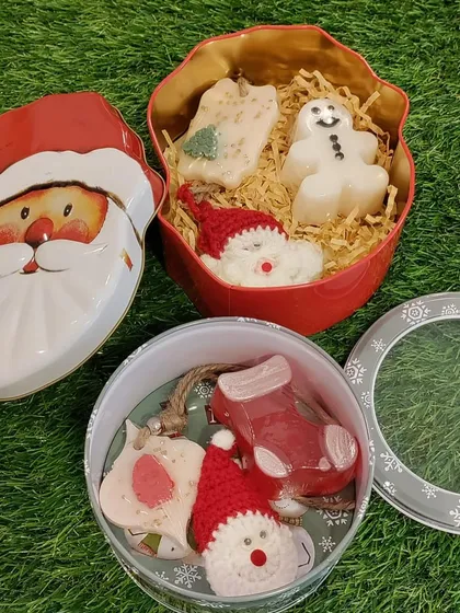 My crochet Santa ornaments are a popular addition to these festive gift tins, which also include handmade soaps and other treats.