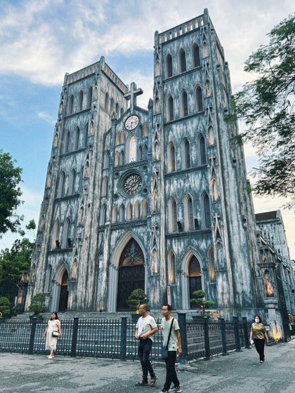 The stunning neo-Gothic architecture of St. Joseph's Cathedral in Hanoi, Vietnam. This shot captures the grandeur and history of the city's landmarks.