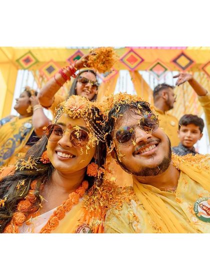 A cool selfie of the couple, covered in turmeric and flowers, capturing the fun, modern vibe of their Haldi ceremony.