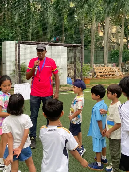 Our coach explaining the rules of the next game. Clear communication and enthusiastic leadership are key to keeping our parties organized and fun for everyone.