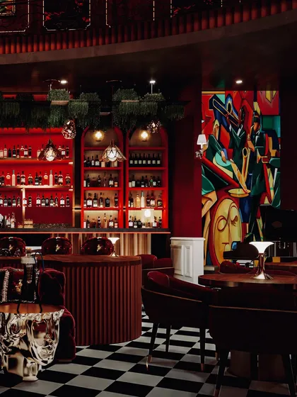 A wide view of the Pune restro-bar, showcasing the lively atmosphere with its mix of seating, bold art, and dramatic lighting.