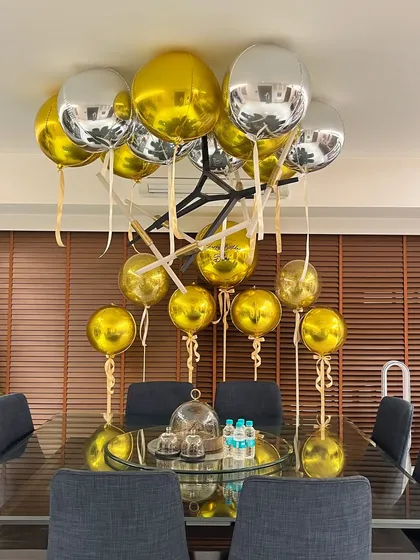We filled this modern dining space with chic gold and silver orb balloons for Arjun Kapoor's birthday dinner, creating a festive yet sophisticated look.