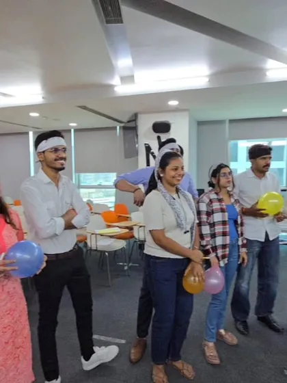 Smiles and focus during a team-building game. My goal is to create a comfortable and fun environment where colleagues can let their guard down, laugh together, and build stronger professional relationships.