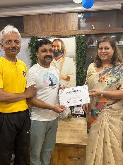 Another proud member of the "Early Risers" team being recognized for his efforts.