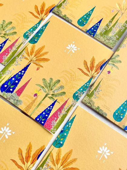 A close-up of the colorful, abstract botanical illustrations used for the Champaner wedding suite. The design is modern yet draws from the natural flora of the heritage location.