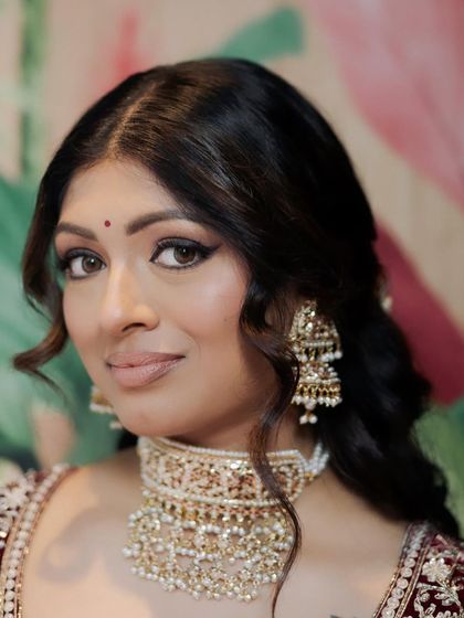 Kavi's eyes hold so much grace. We enhanced them with a classic winged liner and soft shadows, a look that is both elegant and timeless.