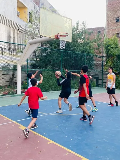 A contested rebound under the basket. We teach our players to be strong and aggressive on the boards.