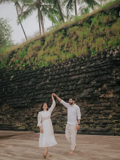 Your pre-wedding shoot should be fun and reflect who you are. This candid moment from a beach pre-wedding in Alibag shows a couple's joyful connection, captured with a natural and documentary-style approach.