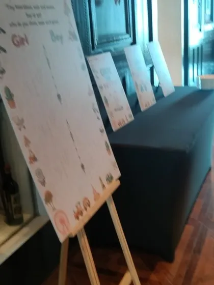 We also provide fun, interactive elements for your baby shower, like these game boards where guests can guess the baby's gender or leave well wishes for the parents-to-be.