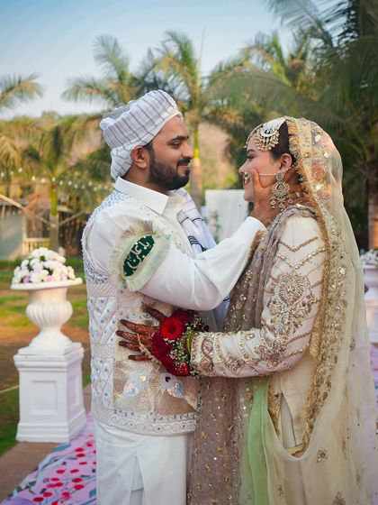 The gentle touch, the loving gaze. This photo from a daytime Nikah ceremony perfectly captures the couple's joy and affection. Our photography aims to freeze these fleeting, heartfelt moments in time.