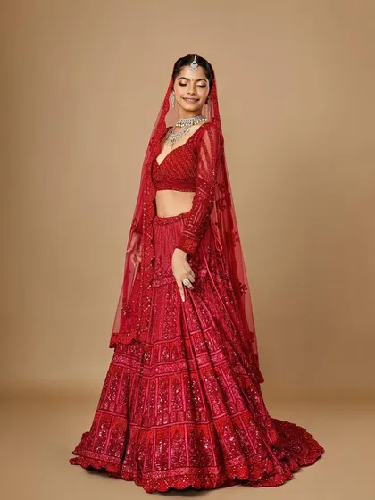A classic red bridal look is timeless for a reason. Here, I’ve balanced the richly detailed lehenga with radiant skin and defined eyes, creating a look that is both traditional and breathtakingly beautiful for the main wedding day.