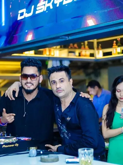 Taking a moment to pose with a guest by the DJ booth. I always appreciate connecting with the people I play for.