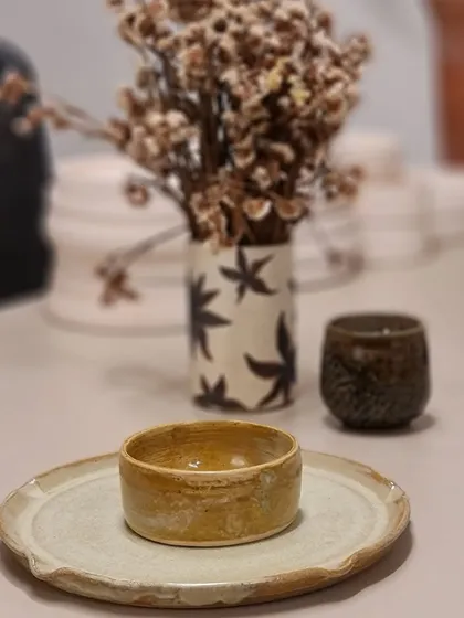 Another look at my Rakhi gift hamper, styled with a small bowl on a rustic plate. Each piece has a unique character that you won't find in mass-produced items.